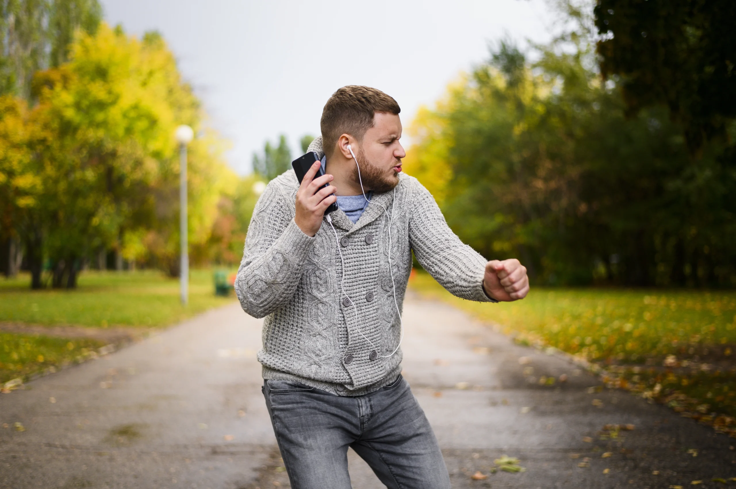 13 strategies to help cope with overwhelm and achieve a more balanced life 1 young man with earphones dancing alley parkwebp scaled