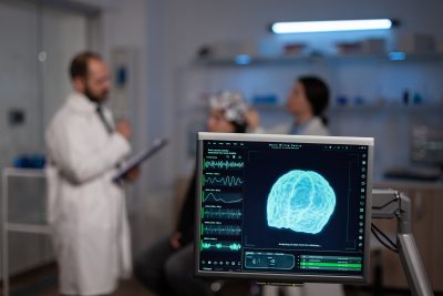neuroscience doctor holding clipboard showing treatment against brain disease patient with eeg headset woman sitting neurological scientific laboratory treating nervous system dysfunctions