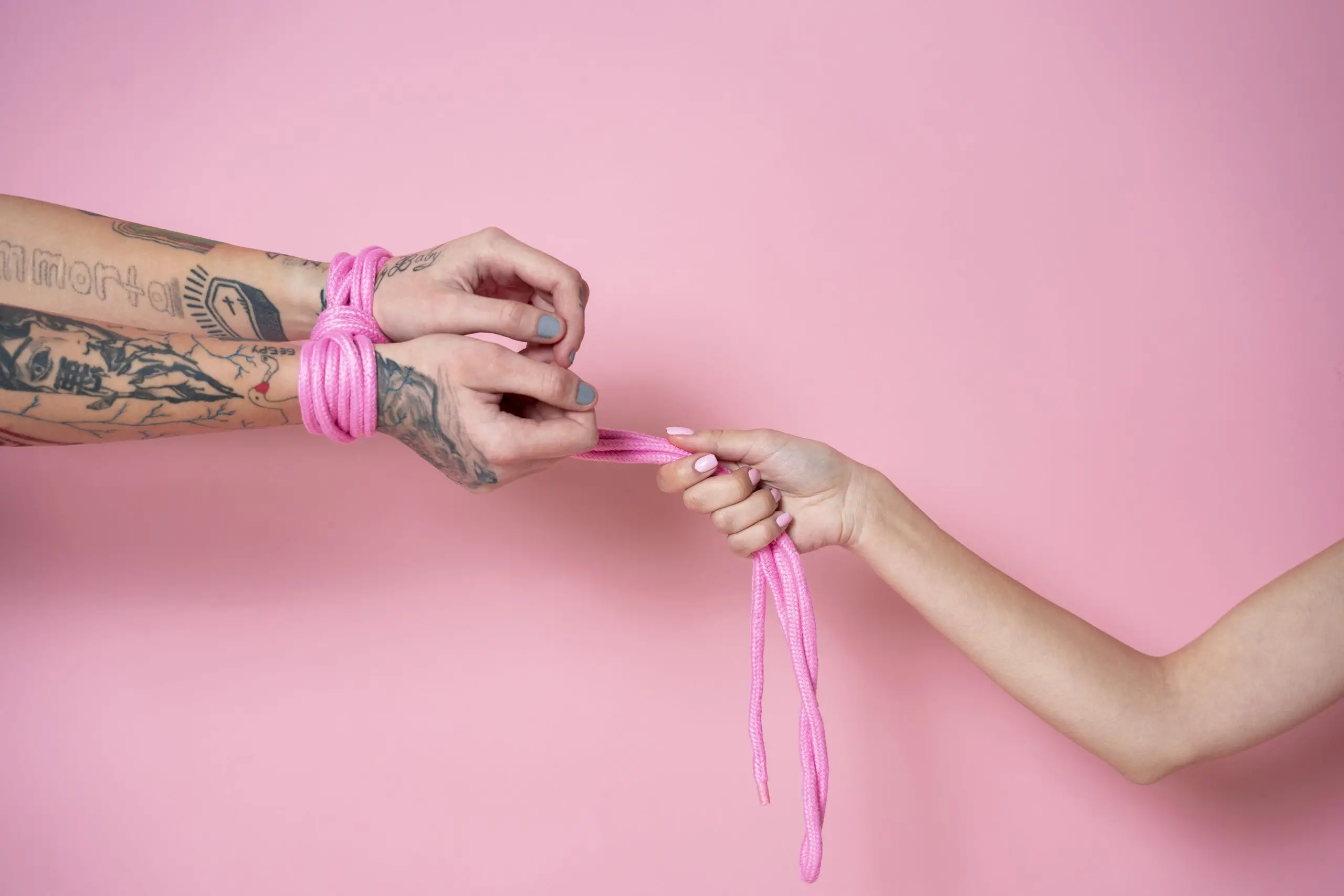side view hands wearing pink rope scaled