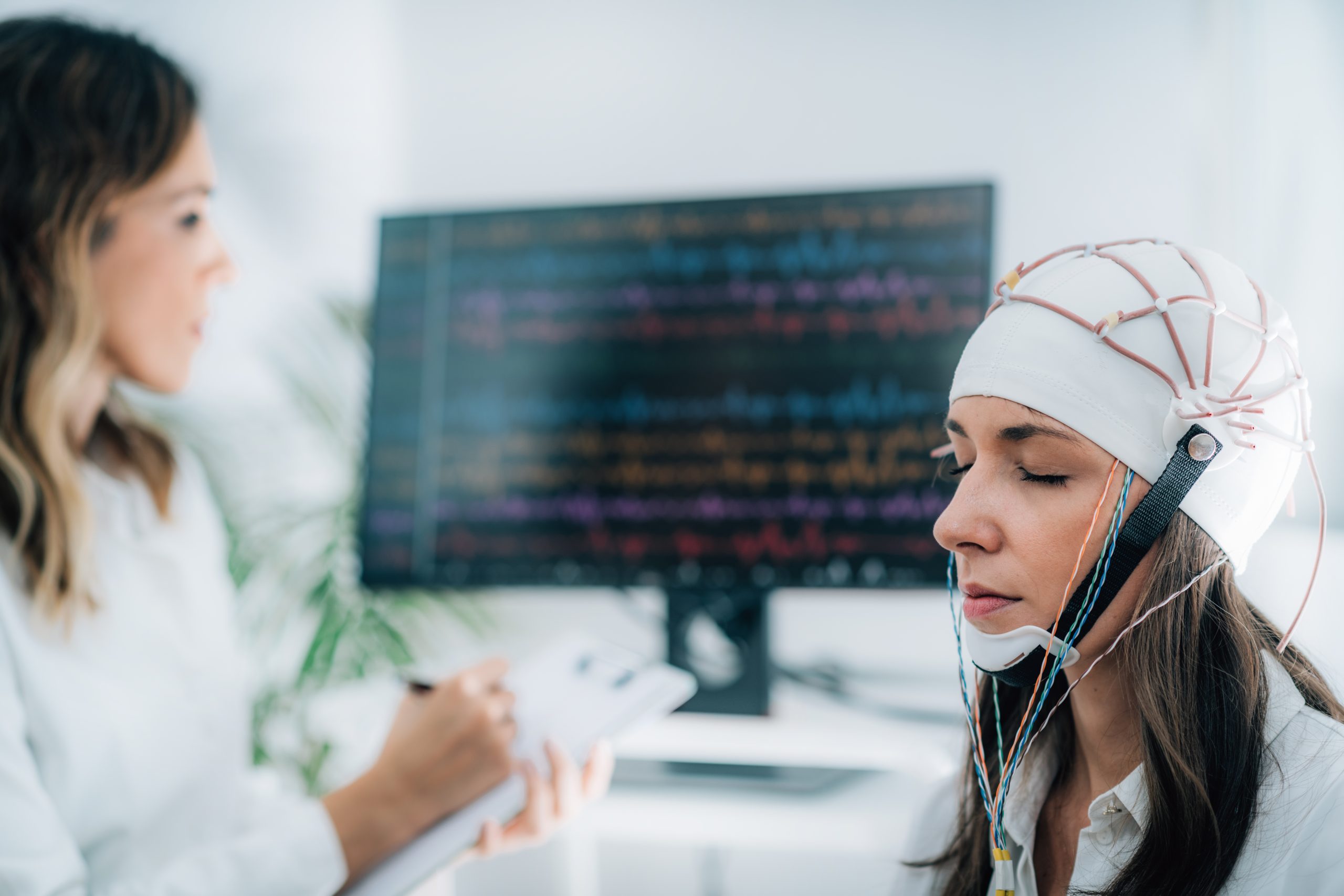 female patient neurology lab doing eeg scan scaled